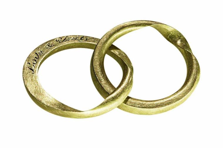 Cox + Power's Fairtrade gold wedding rings are individually made to order. This Hidden ring, consisting of two rings that fit seamlessly together, can be engraved with a message that lies hidden within the ring.